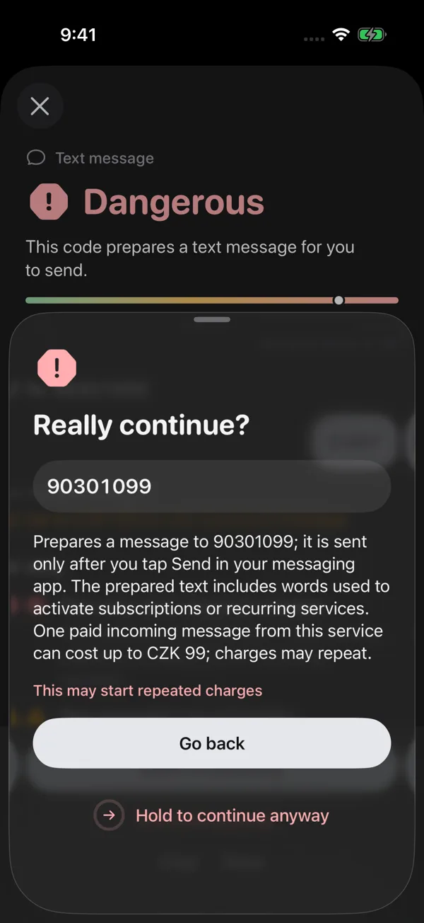 Confirmation before a risky SMS: Go back is the prominent button. Continuing despite the risk requires pressing and holding.